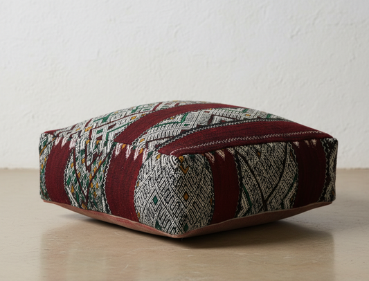 close up view of vintage Moroccan kilim pouf deep red tribal
