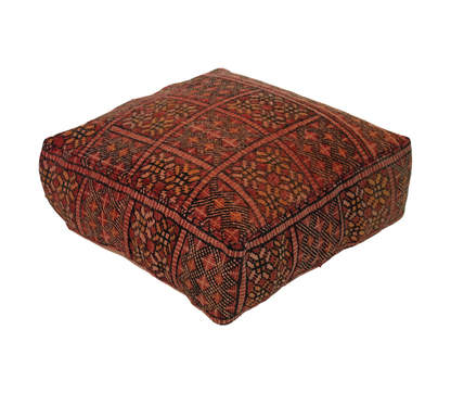 Front view of vintage Moroccan rug pouf terracotta red 60x60 cm 