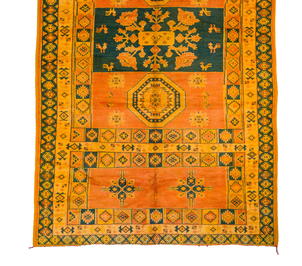 A flat-laid traditional oriental rug with a complex geometric and floral pattern, featuring a dominant orange field, a dark teal blue center, and yellow borders.