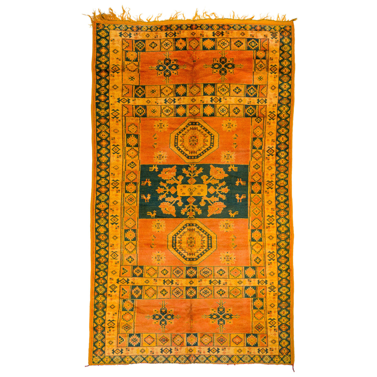An antique-style geometric area rug with a warm orange and yellow field, dark green borders, and central medallions, shown flat against a white background.