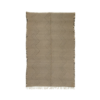 A rectangular Zanafi rug with a taupe-brown base and cream zigzag stripes, finished with fringed edges, shown flat against a white background.