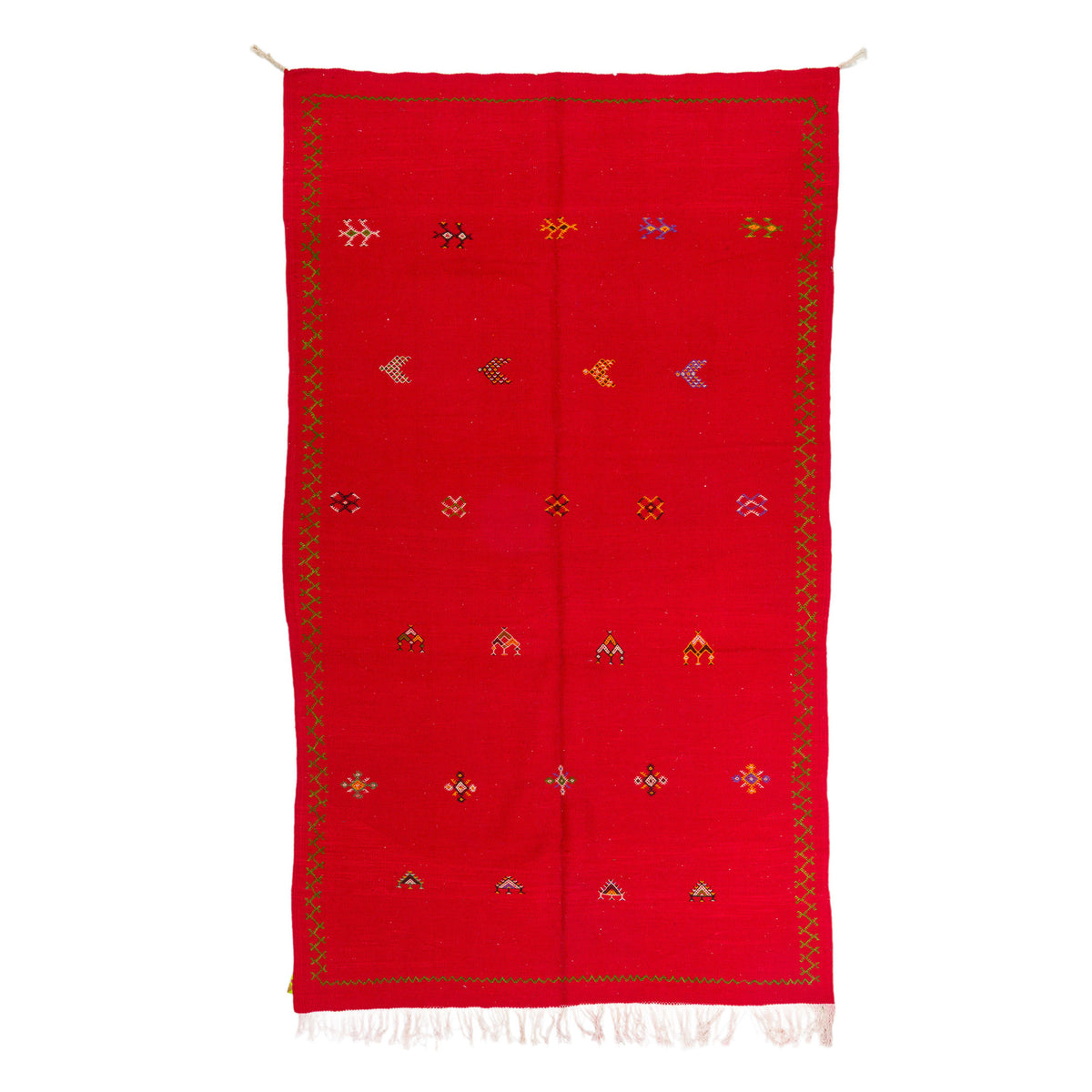 A red handwoven moroccan rug or scarf with a decorative border and small multicolored geometric motifs, shown flat against a white background.