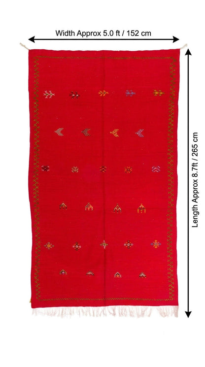 A red woven moroccan rug with small multicolor embroidered motifs and fringe, shown flat on a white background with dimension arrows indicating width about 5.0 ft (152 cm) and length about 8.