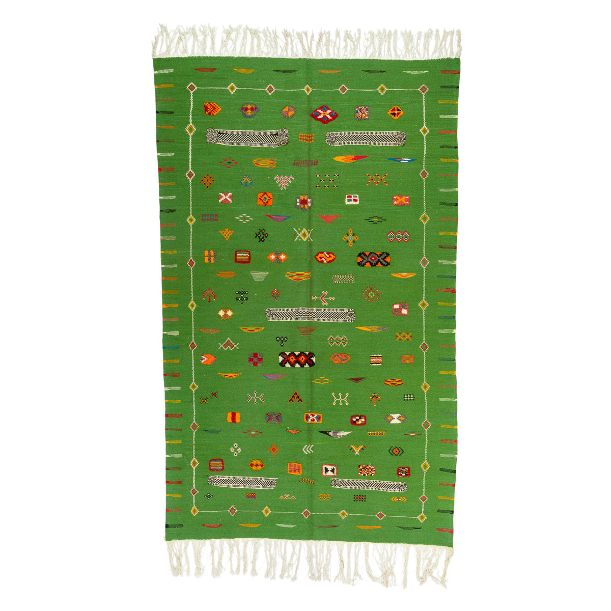 A green Moroccan rug with white fringe on the top and bottom, featuring a central field of colorful geometric patterns and a striped border.