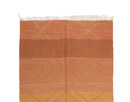 A rectangular wool Zanafi rug with horizontal bands in terracotta, peach, and golden yellow, featuring a subtle geometric pattern and white fringe along the top edge, shown against a plain white background.