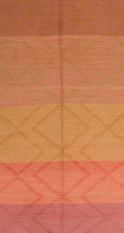 A close-up of a Moroccan Zanafi rug with horizontal bands of muted orange, tan, and coral pink, each featuring a subtle diamond pattern.