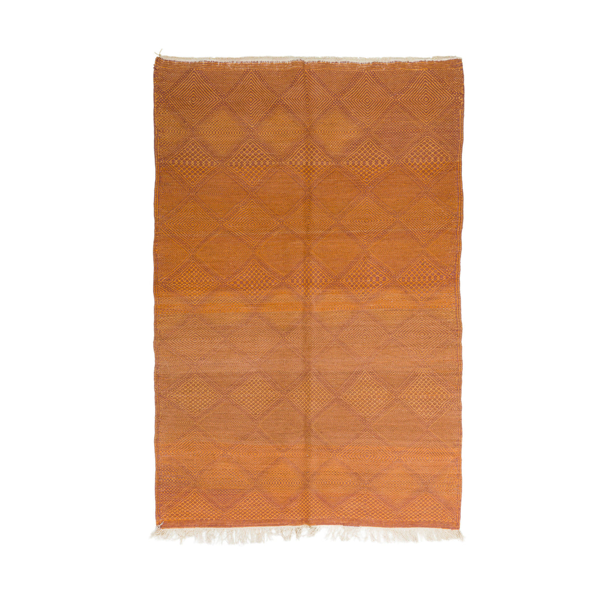 An orange Zanafi rug from Morocco with a geometric diamond pattern and white fringe on the top and bottom, shown flat against a white background.