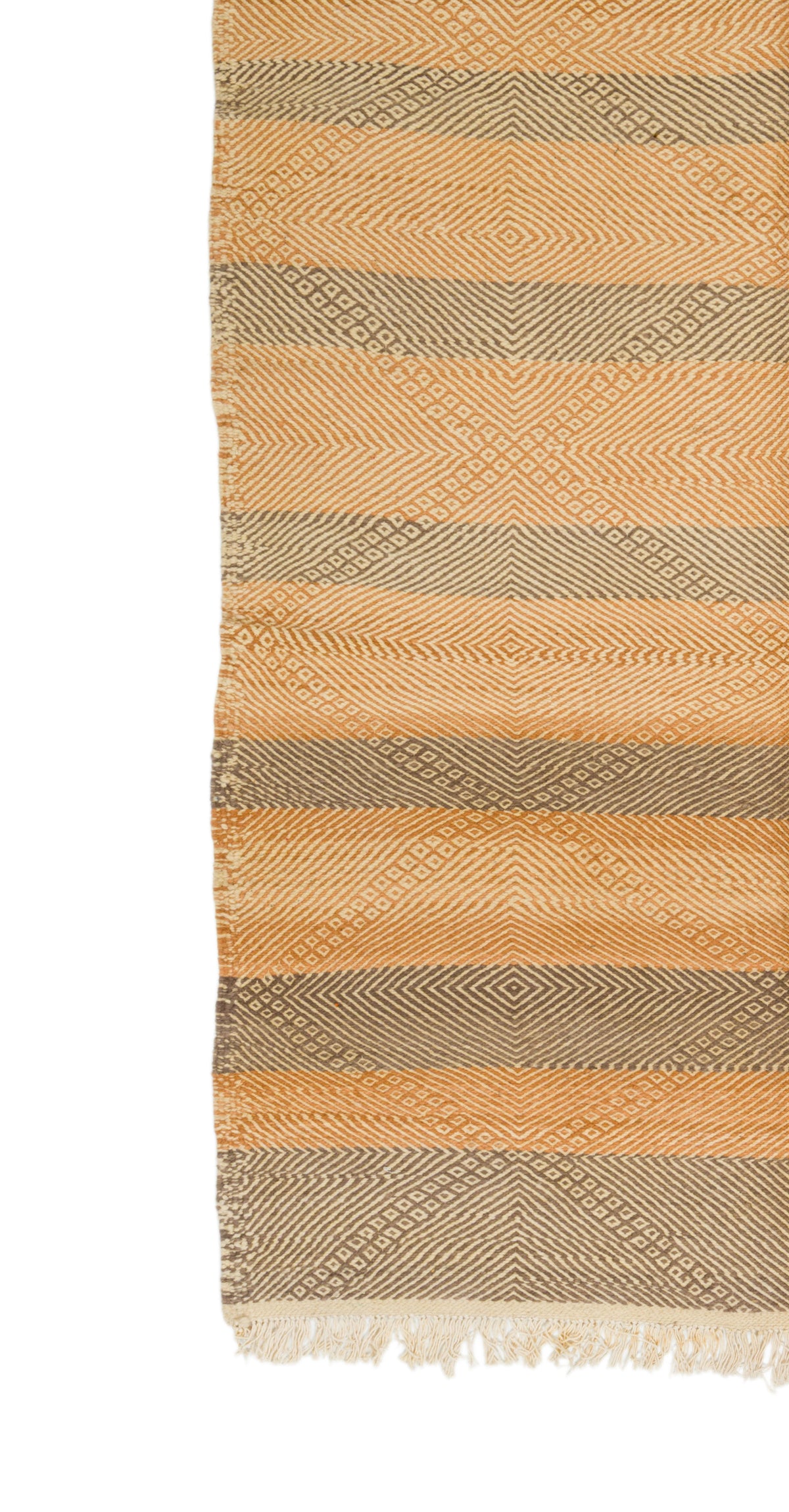 A close-up of a woven rug with horizontal stripes in warm beige, tan, and taupe, featuring a textured geometric pattern and fringed edges.