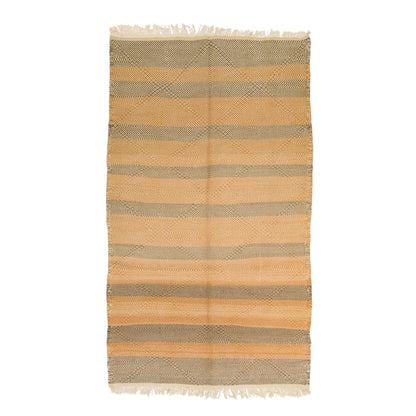 A Moroccan wool rug with horizontal stripes in warm tan, beige, and muted gray, featuring fringed edges on a plain white background.