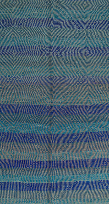 A close-up of a Moroccan Zanafi Rug with horizontal stripes in shades of blue, teal, and gray, featuring a subtle diamond pattern.