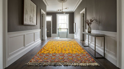  one-of-a-kind Moroccan wool rug was handwoven by Berber women artisans in the Atlas Mountains of Morocco using traditional rug-making techniques.

The rug is centre stage in a hallway.