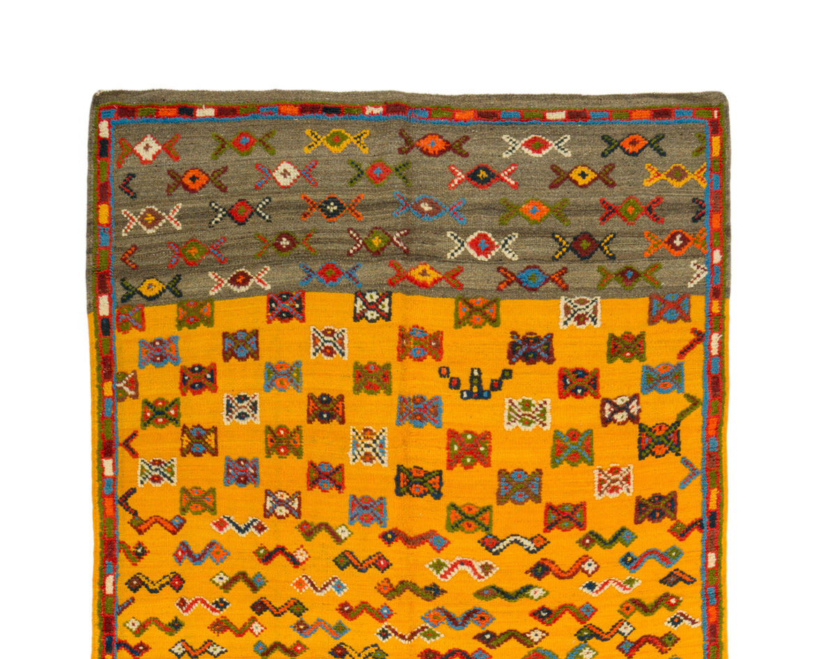 Moroccan wool rug was handwoven by Berber women artisans in the Atlas Mountains of Morocco using traditional rug-making techniques.


