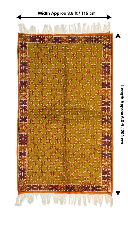 A rectangular patterned Morocca rug with fringe on both ends, shown flat against a white background with measurement arrows and text indicating width approx 3.8 ft (115 cm) and length approx 6. 