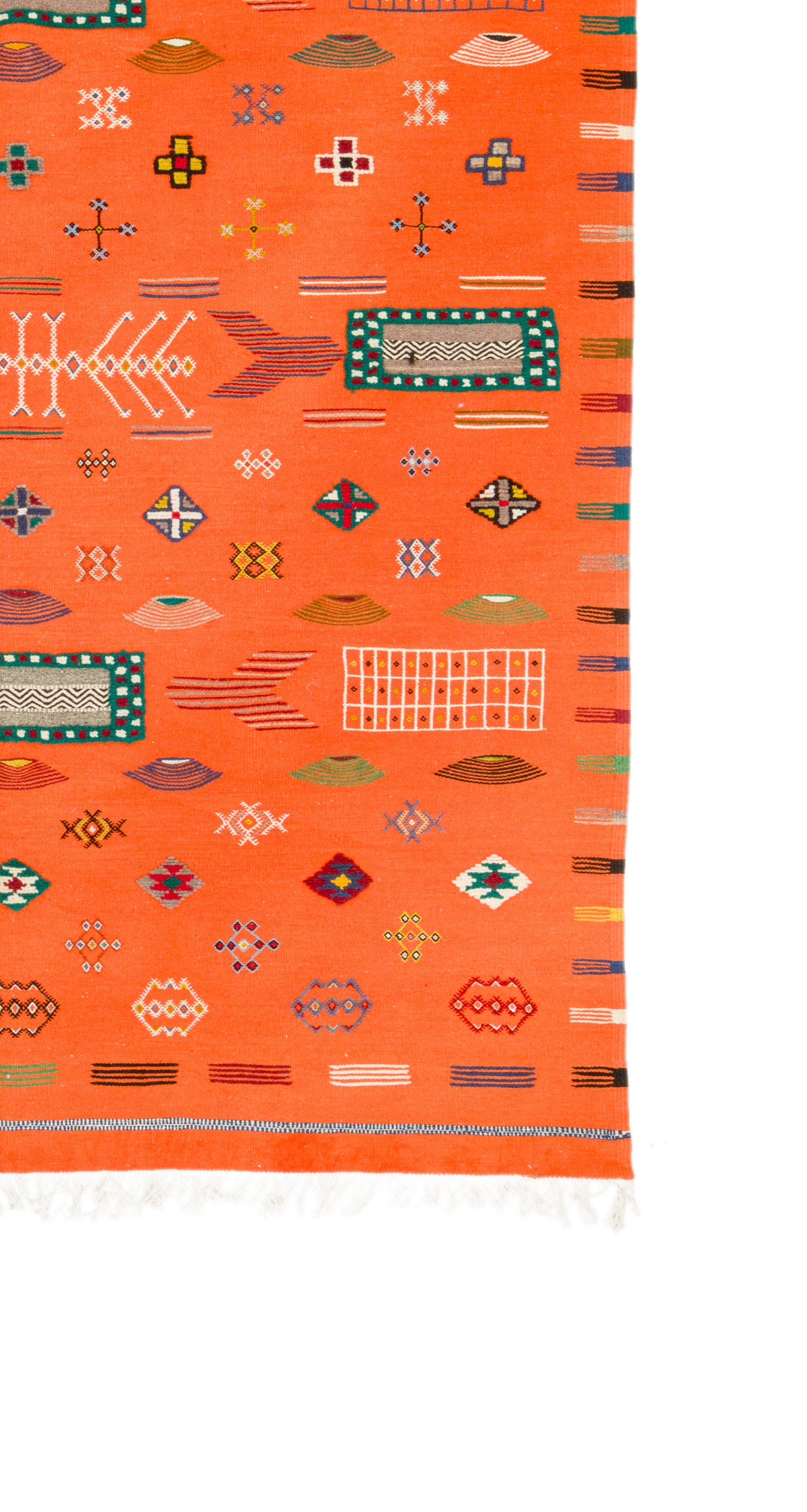 An orange Moroccan wool rug with fine geometric patterns and white fringe, shown against a plain white background.