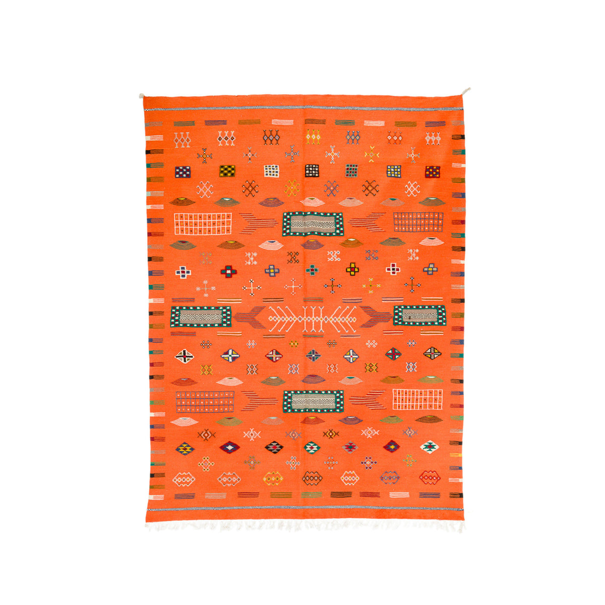 An orange Moroccan woven rug with a geometric pattern, featuring a central fish motif, diamond shapes, and striped borders on a white background.