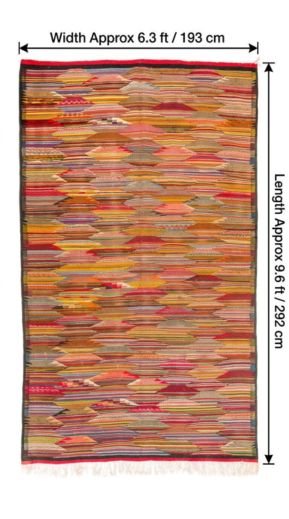 A multicolor woven area rug from taznakht with a geometric cubist, layered pattern of horizontal and diagonal textile strips in red, orange, yellow, beige, and brown tones. The rug is shown with black dimension lines and text overlays indicating its width is approximately 6.