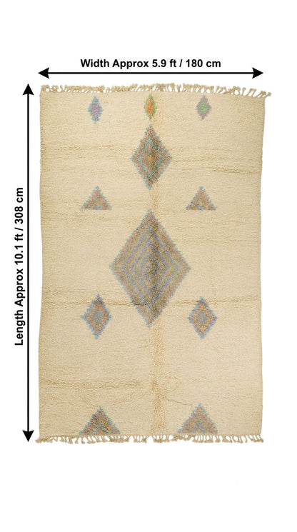 A rectangular woven rug with a cream base and geometric diamond and triangle motifs in muted gray, beige, and soft blue, shown with dimension arrows. A moroccan shag rug.