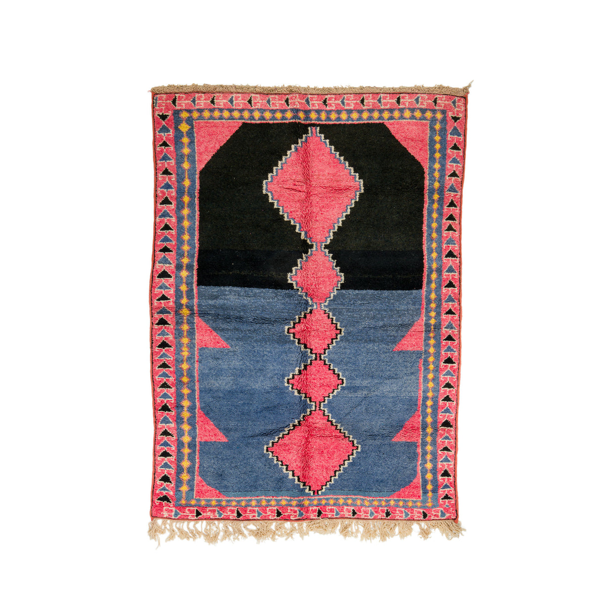 A rectangular Moroccan Azilal hand-woven rug with a geometric tribal design, featuring a black upper section, a blue lower section, and pink diamond and triangle motifs, framed by a red patterned border with beige fringe.