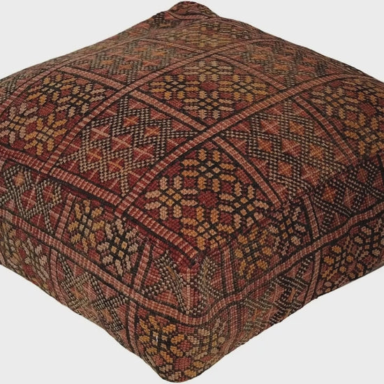 Video of vintage Moroccan rug pouf terracotta red showing texture and Berber details 