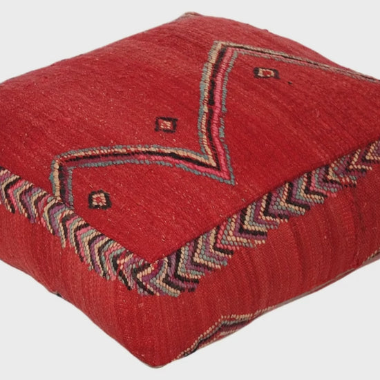 Video of vintage Moroccan kilim pouf red tribal showing texture and Berber details 