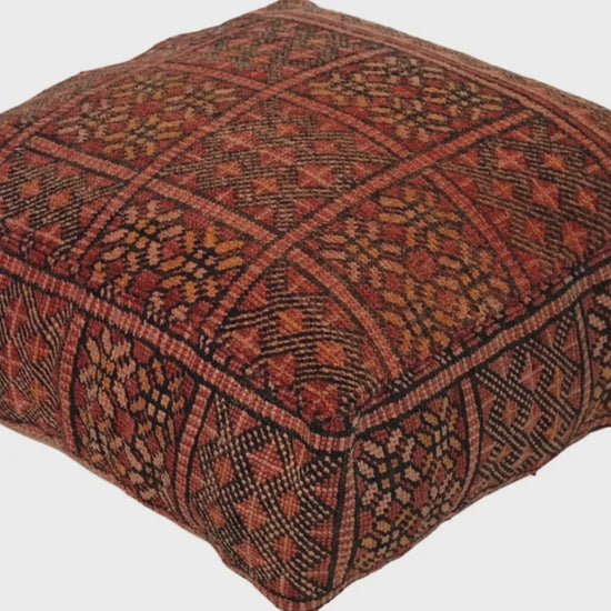 Video of vintage Moroccan rug pouf terracotta red showing texture and Berber details 