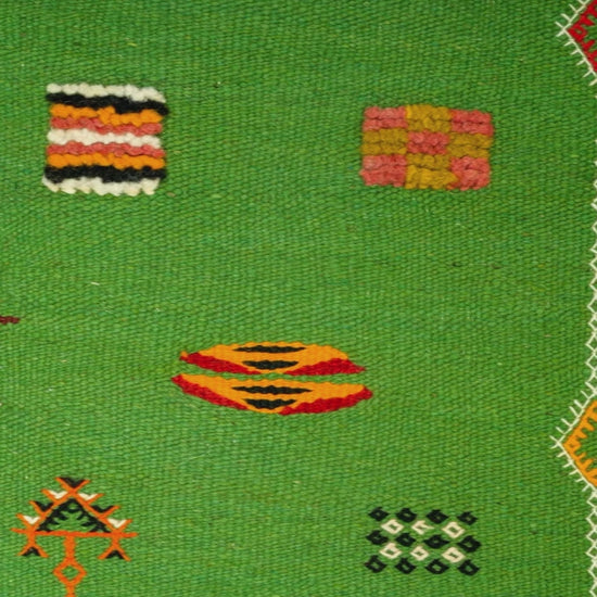 video cloe-up of a green moroccan rug