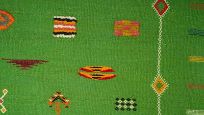 video cloe-up of a green moroccan rug
