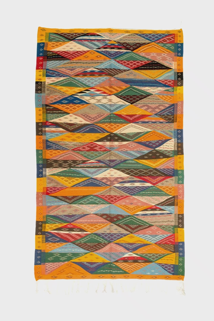 video of a cubist moroccan rug on a white background