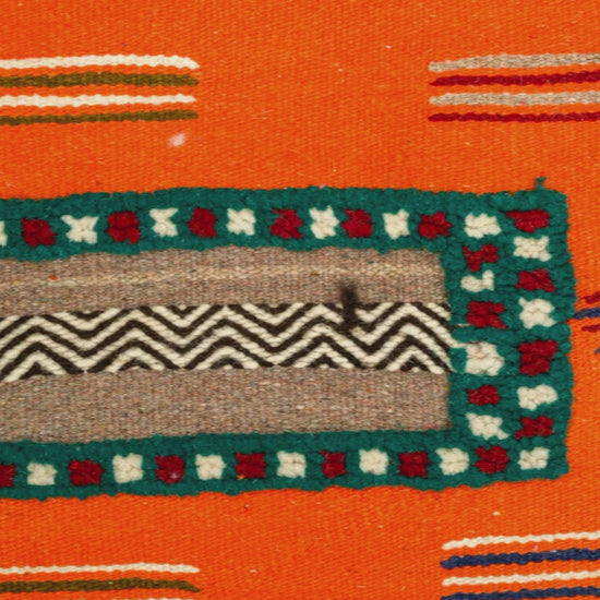 video close-up detail of a moroccan hand embroidered rug.