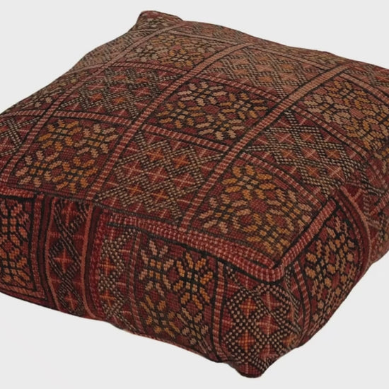 Video of vintage Moroccan rug pouf terracotta red showing texture and Berber details 