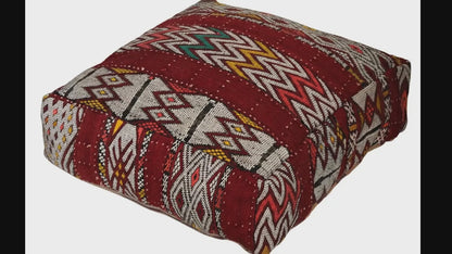 Video of vintage Moroccan kilim pouf burgundy geometric showing texture and Berber details 