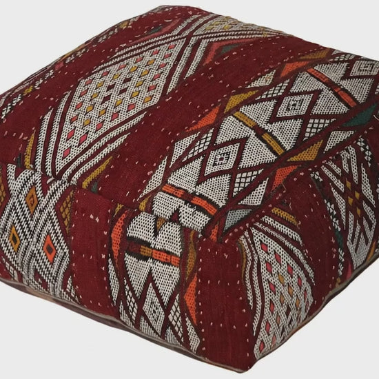 Video of vintage Moroccan kilim pouf  burgundy geometric showing texture and Berber details 