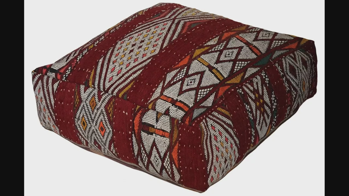 Video of vintage Moroccan kilim pouf  burgundy geometric showing texture and Berber details 