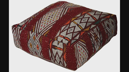 Video of vintage Moroccan kilim pouf  burgundy geometric showing texture and Berber details 