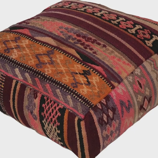 Video of vintage Moroccan kilim pouf burgundy rose multi showing texture and Berber details 