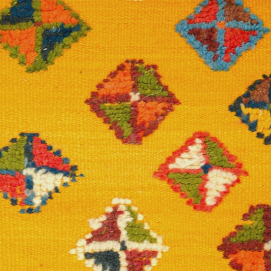 video close-up of a yellow moroccan rug