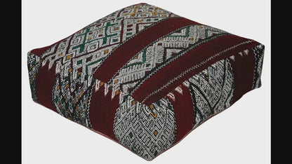Video of vintage Moroccan kilim pouf deep red tribal showing texture and Berber details 