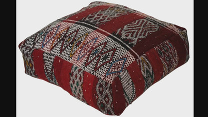 Video of vintage Moroccan kilim pouf  deep red tribal showing texture and Berber details 