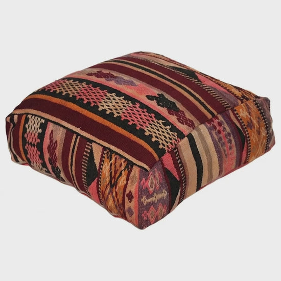 Video of vintage Moroccan kilim pouf pouf  burgundy multi showing texture and Berber details 